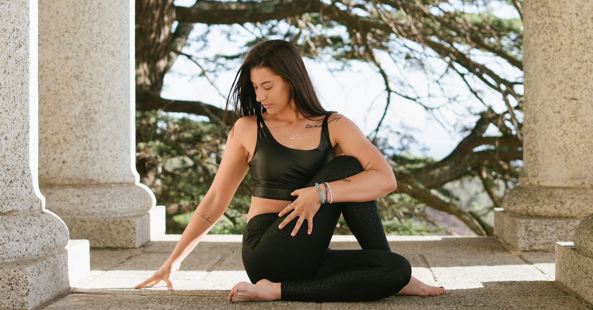 How can I determine my XYZ position? - Woman in Black Tank Top and Black Leggings Sitting on Floor