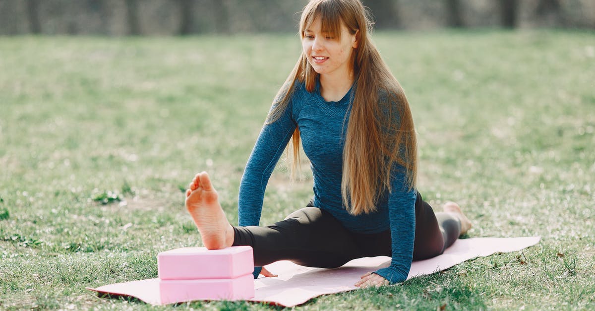 How can I determine the bottleneck for block lag? - Positive young woman doing yoga with blocks on lawn