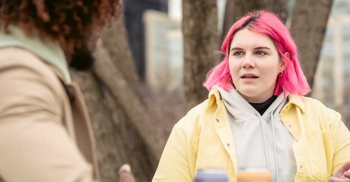 How can I disable tree sway in CS:GO? - Woman speaking with faceless black man in park