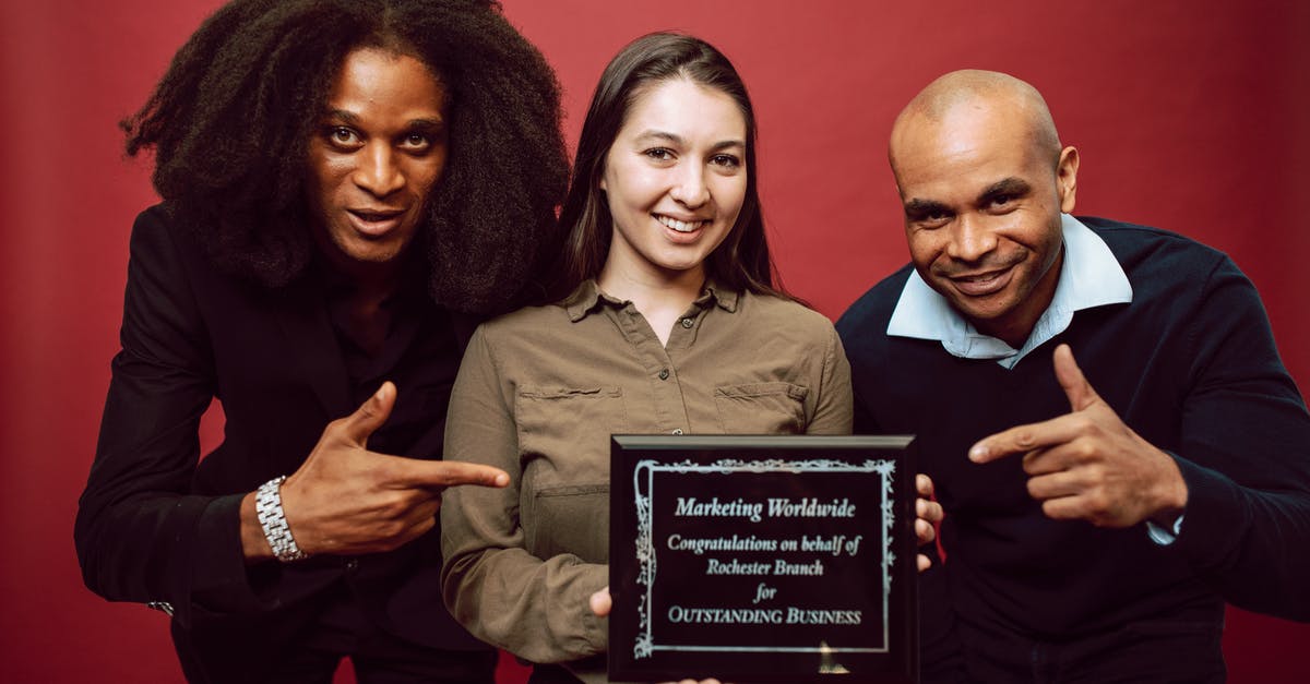 How can I earn Diplomatic Victory Points? - Businesspeople Posing with a Recognition Award How can I earn Diplomatic Victory Points? - Businesspeople Posing with a Recognition Award
