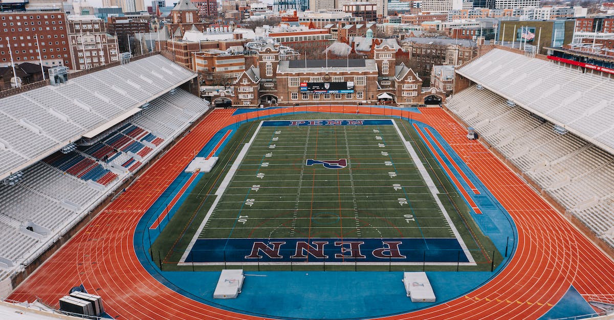 How can I easily remove grass from a large area? - From above of modern stadium with green football field and many seats in tribune How can I easily remove grass from a large area? - From above of modern stadium with green football field and many seats in tribune