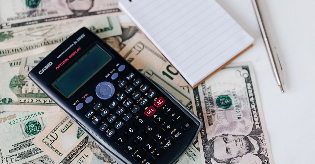 How can I efficiently manage my stash unit's space/weight? - From above electronic calculator and notepad placed over United States dollar bills together with metallic pen for budget planning and calculation