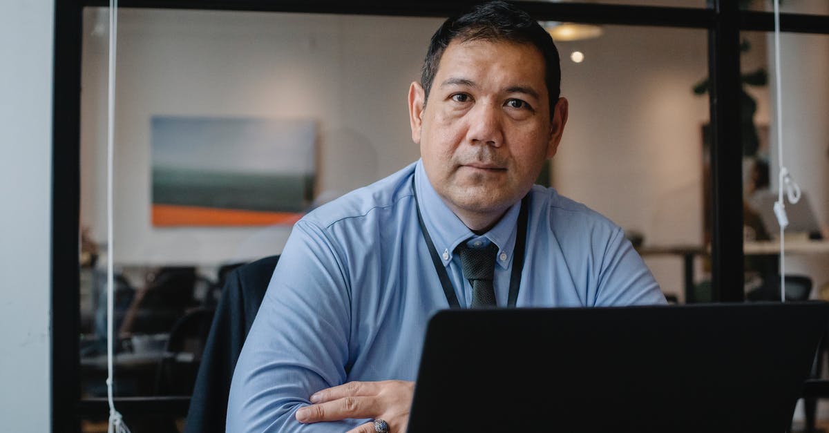 How can I fight a boss without summoning using an item? [closed] - Confident ethnic male entrepreneur using laptop during business work in modern workspace and looking at camera