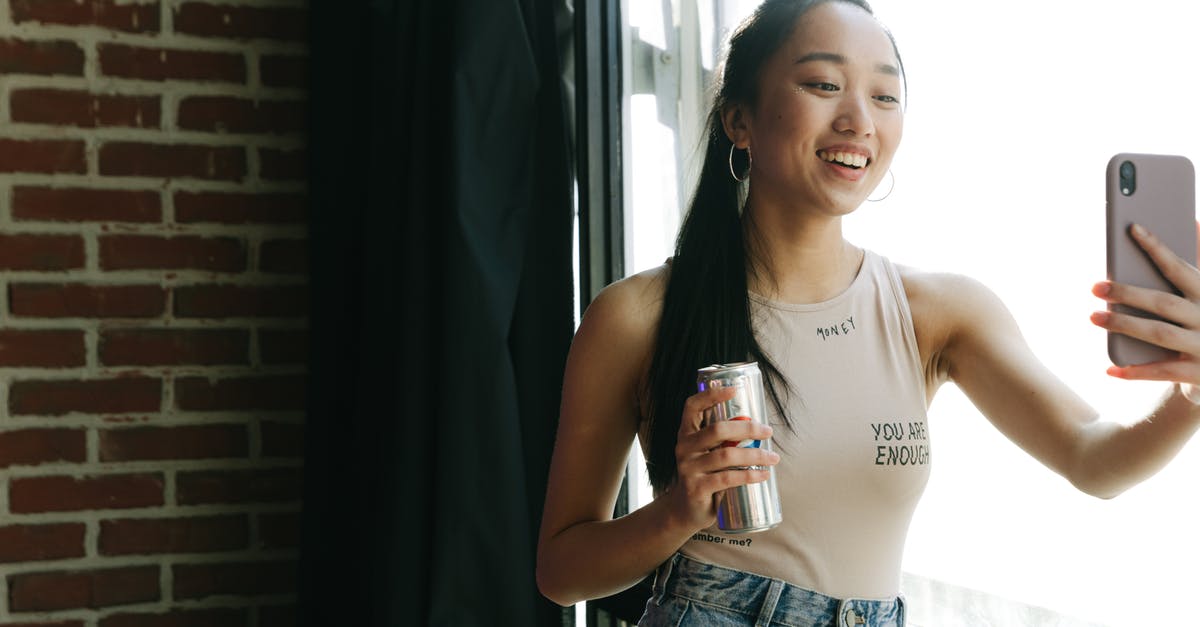 How can I get 100% happiness? -
A Vlogger in a Tank Top Using Her Smartphone How can I get 100% happiness? -
A Vlogger in a Tank Top Using Her Smartphone