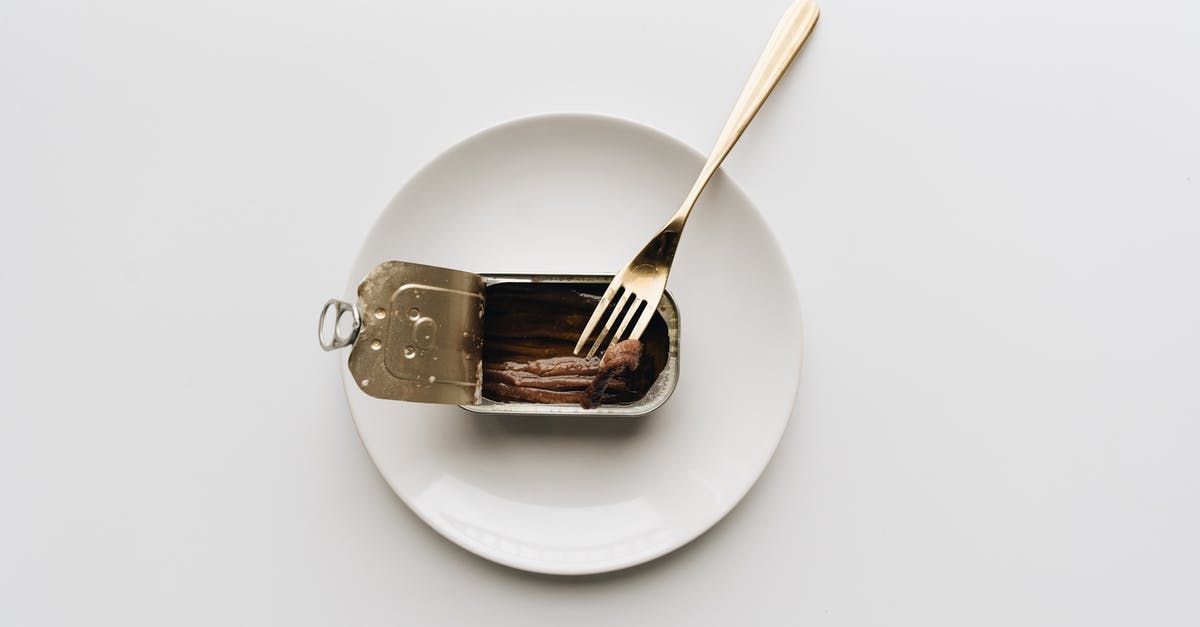How can I get an Atlas Pass? - A Can of Anchovies with Fork on a White Plate