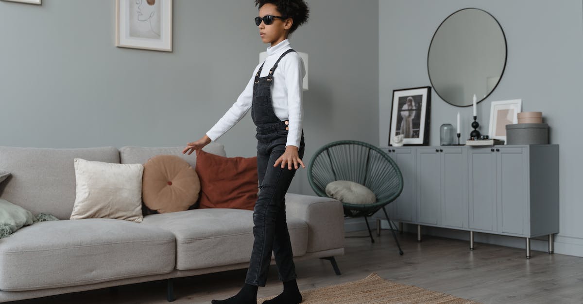 How can I get rid of a blind Cave Troll? - Woman in White Long Sleeve Shirt and Black Pants Sitting on White Couch