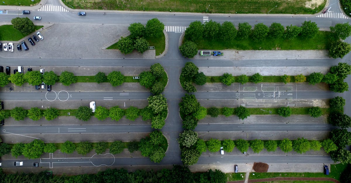 How can I get the DLC cars in Saints Row IV? - Aerial Photography of Parking Lot With Trees