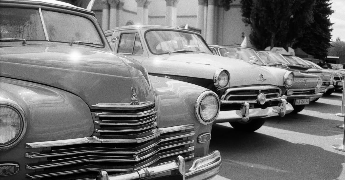 How can I get the DLC cars in Saints Row IV? - Grayscale Photo of Classic Cars