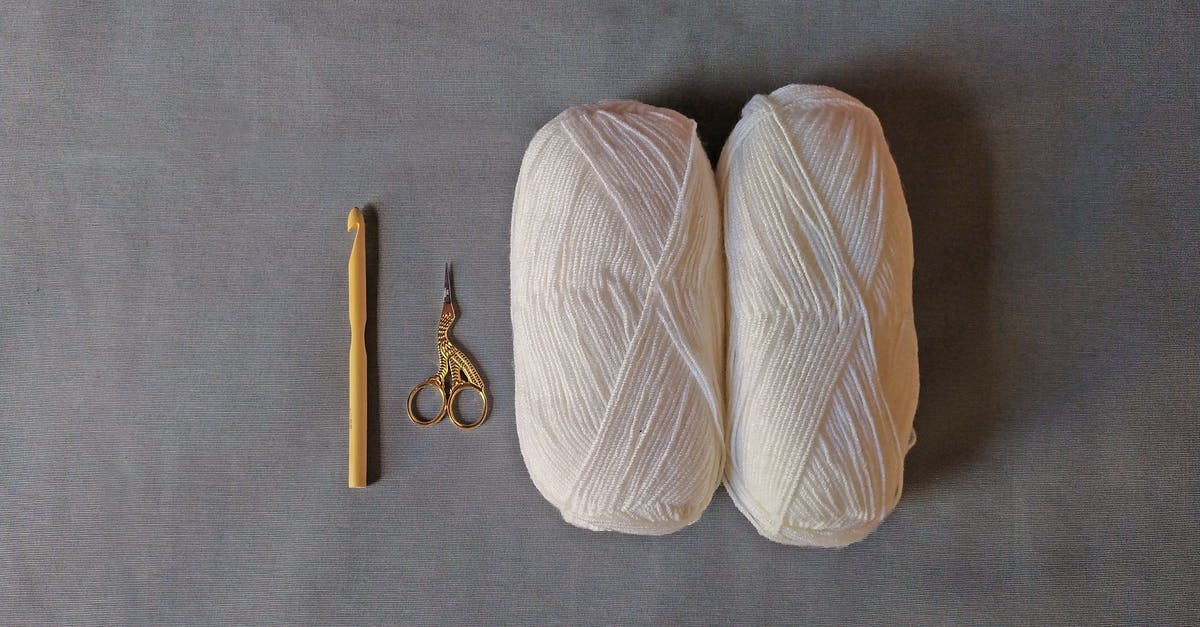 How can I get the materials required for crafting TNT easily? - Two White Yarn Roll Beside Gold Scissor