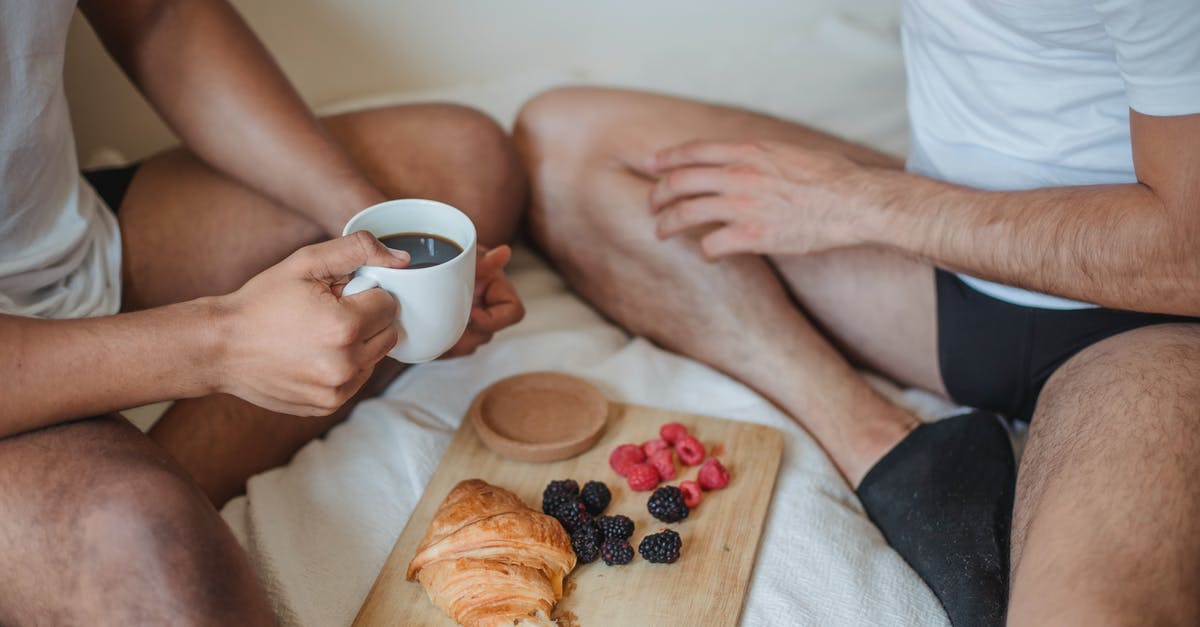 How can I have two profiles, with two skins, in Minecraft? [duplicate] - Two Unrecognizable Men Sitting on Bed and Having Breakfast