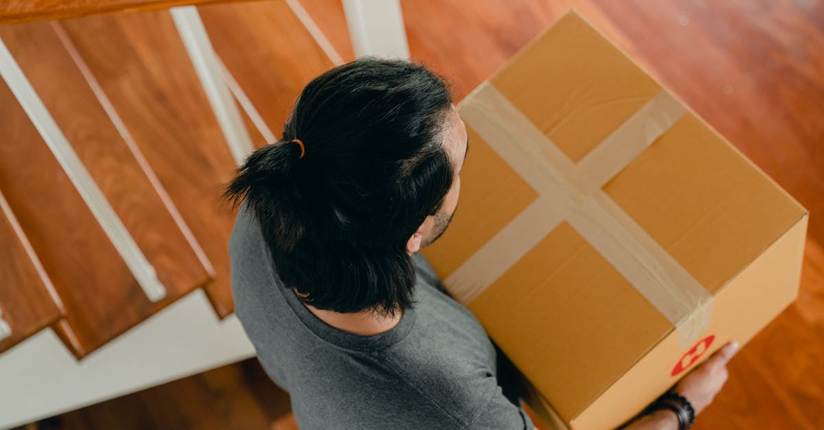 How can I improve my gameplay to carry myself out of Bronze League? [closed] - Man carrying box in new apartment