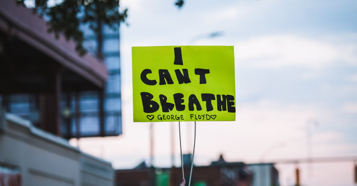 How can I increase my chances of finding the Missing Poster? - Crop faceless person showing paper with i can t breath inscription during Black Lives Matter movement demonstration