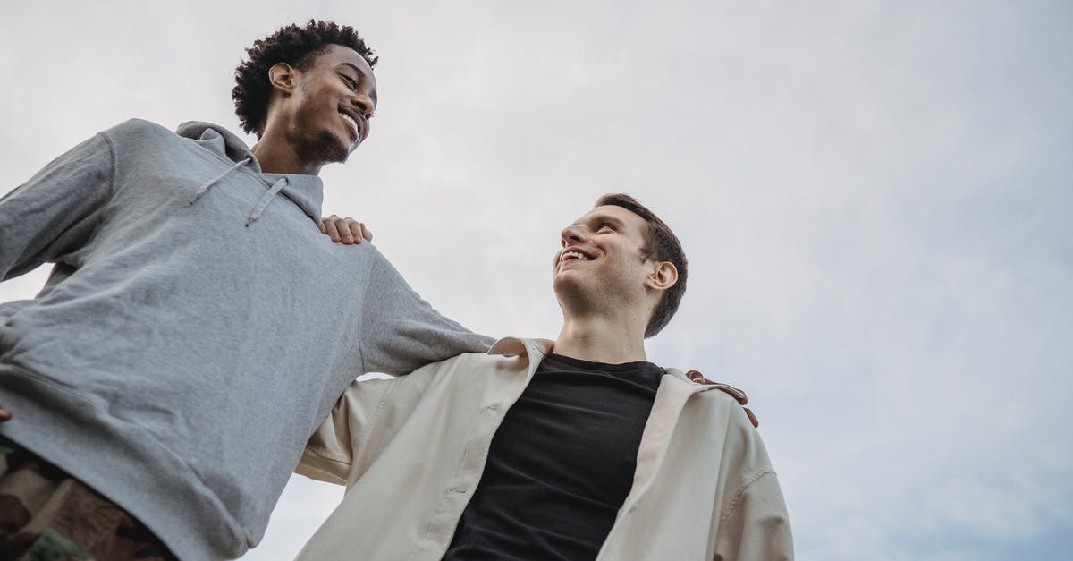 How can I keep my Kings from fighting each other? - Happy young multiethnic male friends side hugging against cloudy sky How can I keep my Kings from fighting each other? - Happy young multiethnic male friends side hugging against cloudy sky