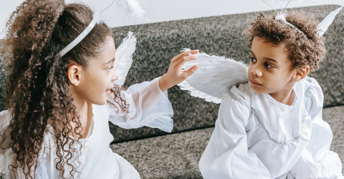 How can I level magic abilities in the game? - Little cute African American girl with curly hair touching wing of angel costume of friend How can I level magic abilities in the game? - Little cute African American girl with curly hair touching wing of angel costume of friend