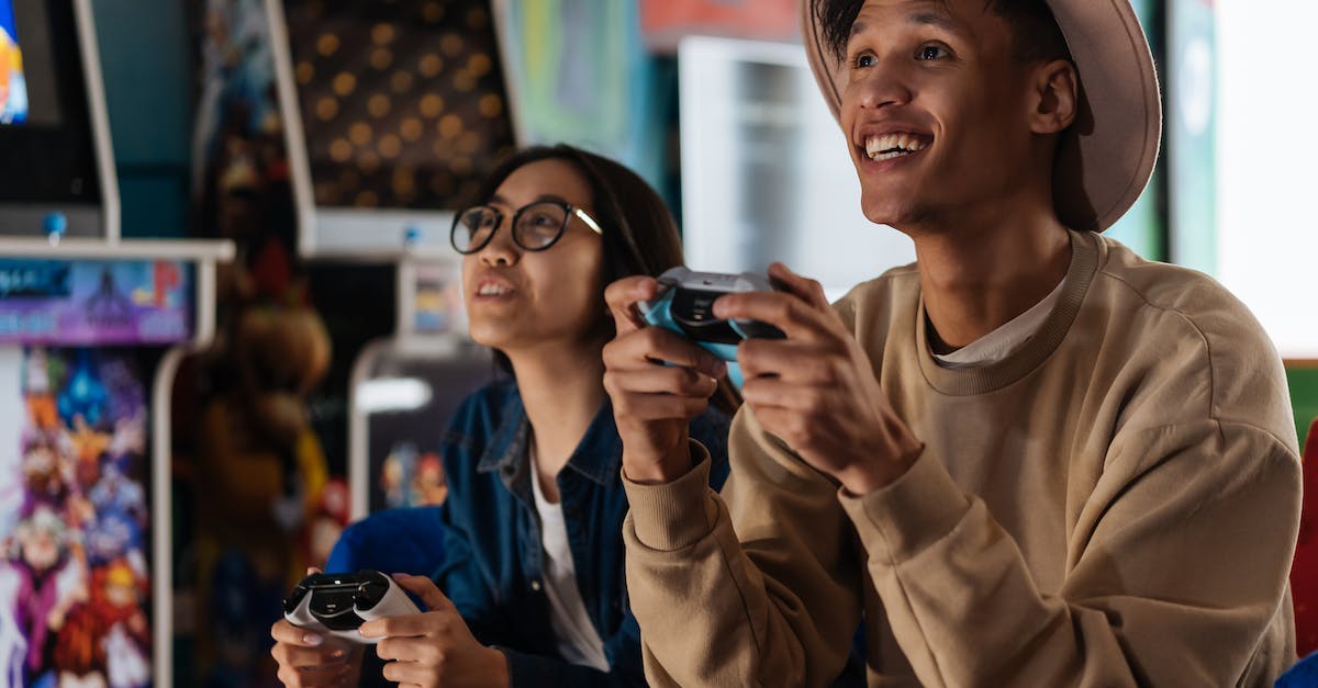 How can I look up other player's ranks while playing or drafting for hero league? - A Young Man and Woman Having Fun Playing Video Game