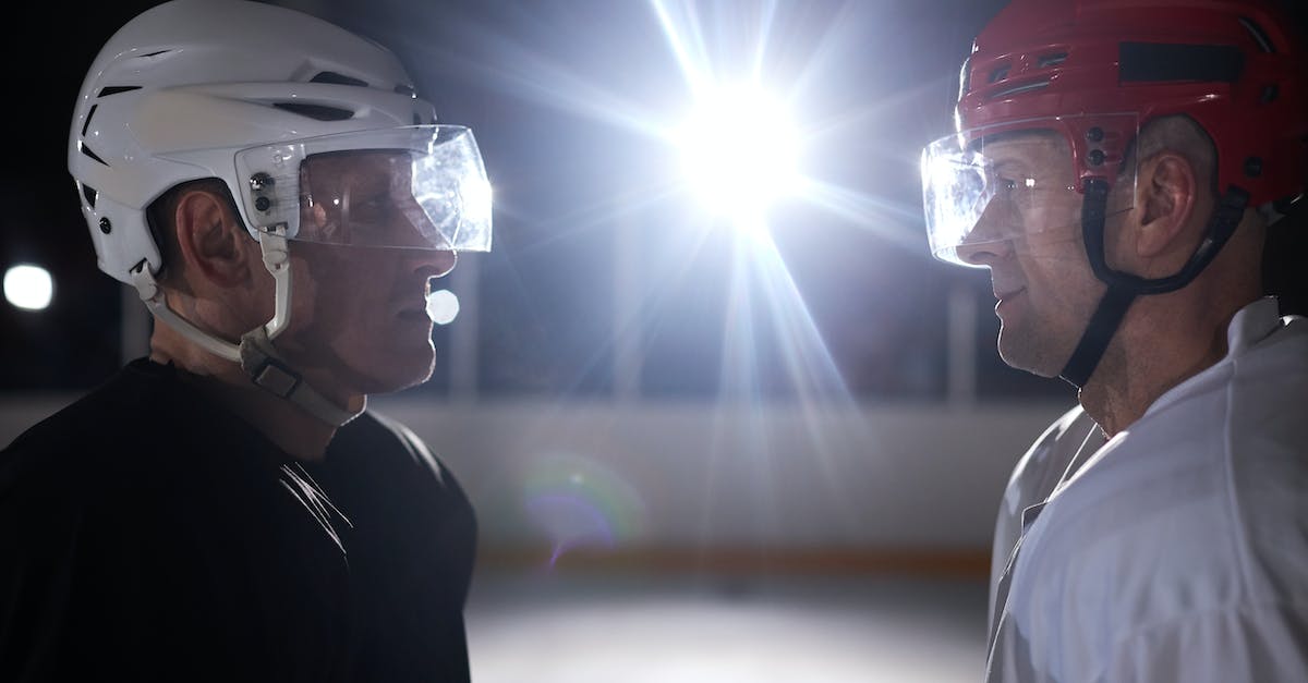 How can I look up other player's ranks while playing or drafting for hero league? - Two Competitive Ice Hockey Players Looking at Each Other