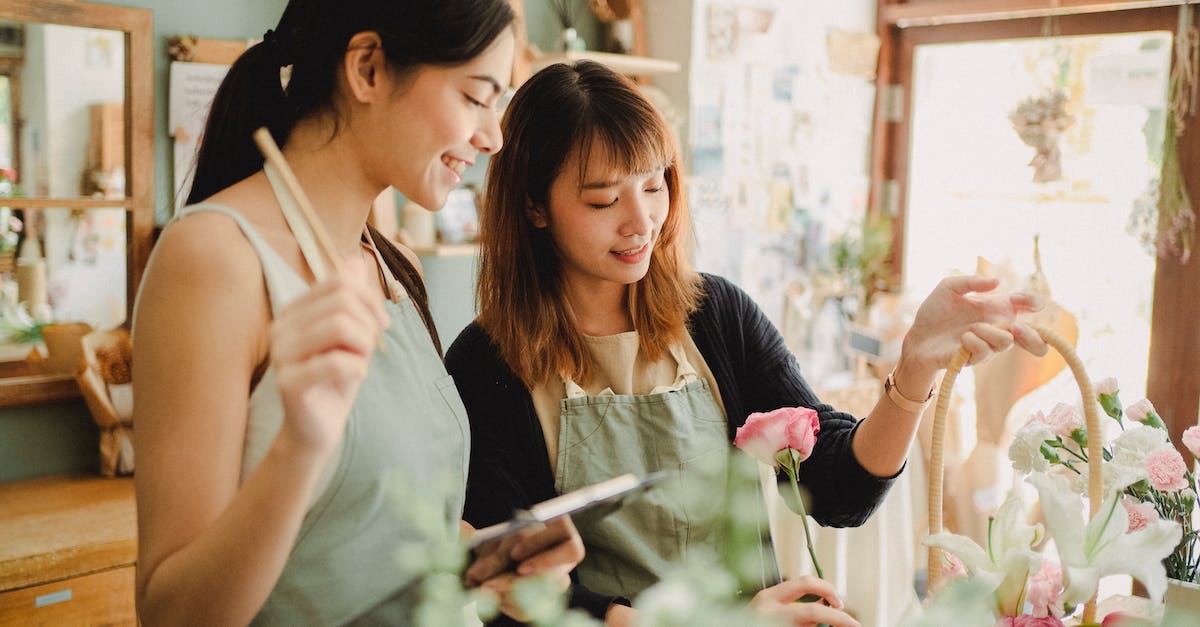 How can I make 'Kulki' run on Windows 7? - Young glad ethnic female partners creating flower bouquet in basket at table while working in daylight How can I make 'Kulki' run on Windows 7? - Young glad ethnic female partners creating flower bouquet in basket at table while working in daylight