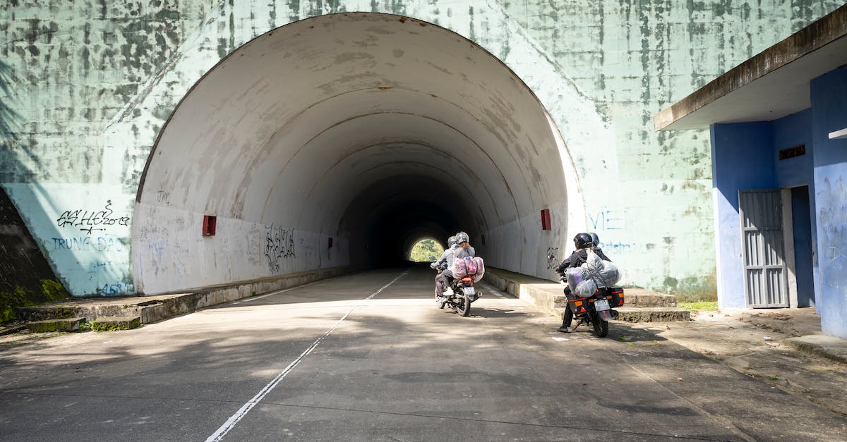 How can I make a guard move out of the way? - Anonymous people riding motorbikes near tunnel