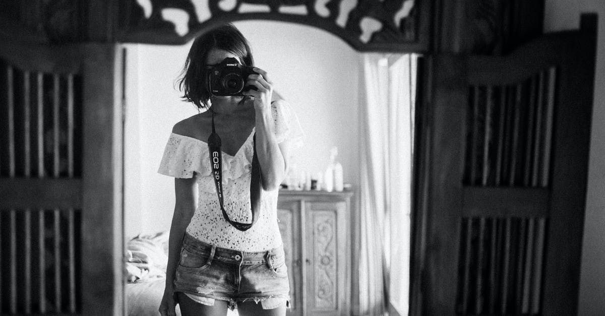 How can I make a short timer using only command blocks in 1.9? [duplicate] - Black and white of casual female photographer in summer clothes standing against mirror in light room and taking photo with camera
