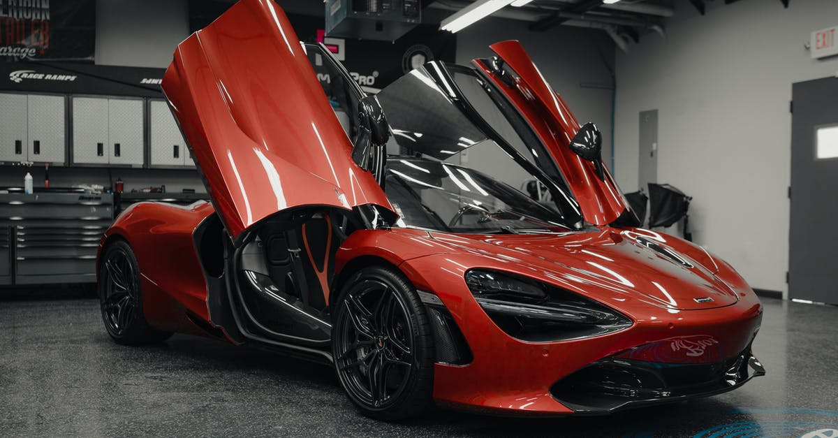 How can I make an automatic door that opens for me only? - Luxury sports red car in showing room