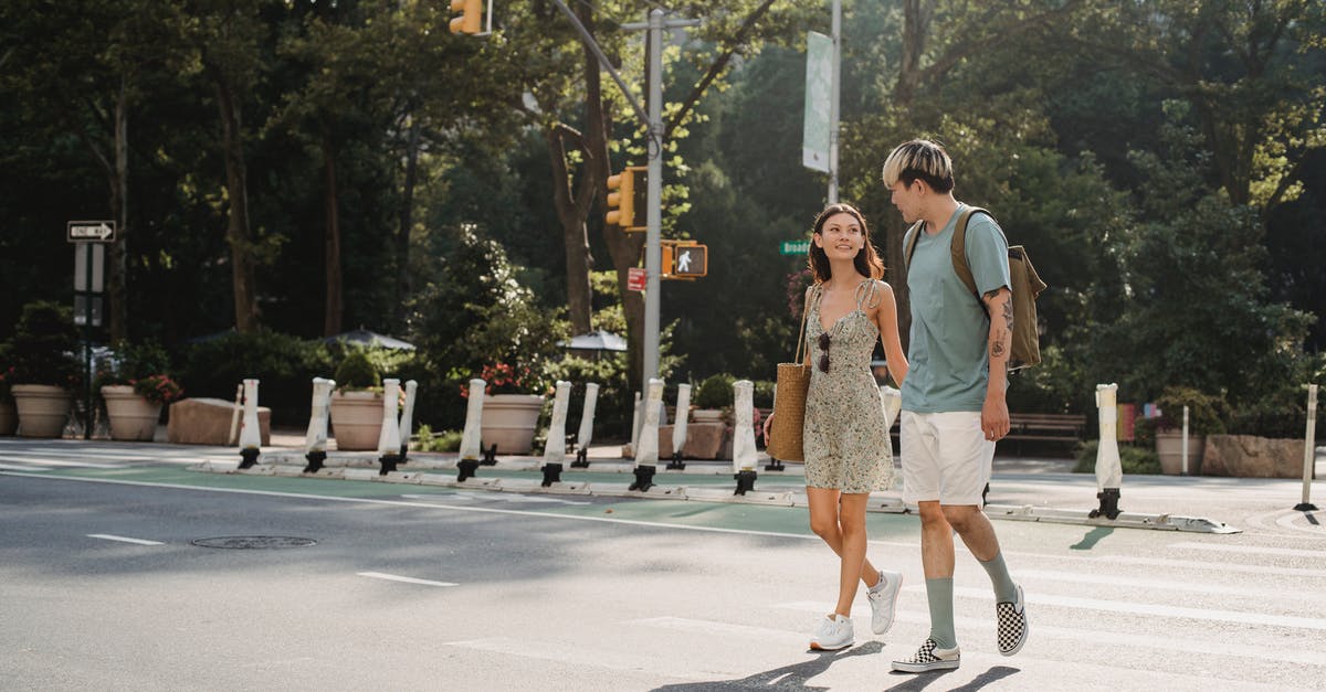 How can I make bullets rotate the other way with the Skimmer? - Full body of happy young girlfriend carrying bag while walking on asphalt crosswalk with boyfriend How can I make bullets rotate the other way with the Skimmer? - Full body of happy young girlfriend carrying bag while walking on asphalt crosswalk with boyfriend