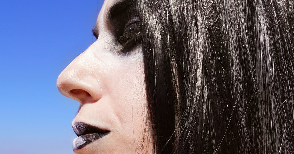 How can I make my Gun Mettle Coin look like it was before the halloween update? - Shallow Focus Photography of Person's Face Side View