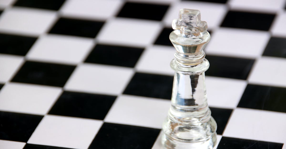How can I move an installed game from one Steam library folder to another? - Clear Glass Chess Piece on Black and White Checkered Table