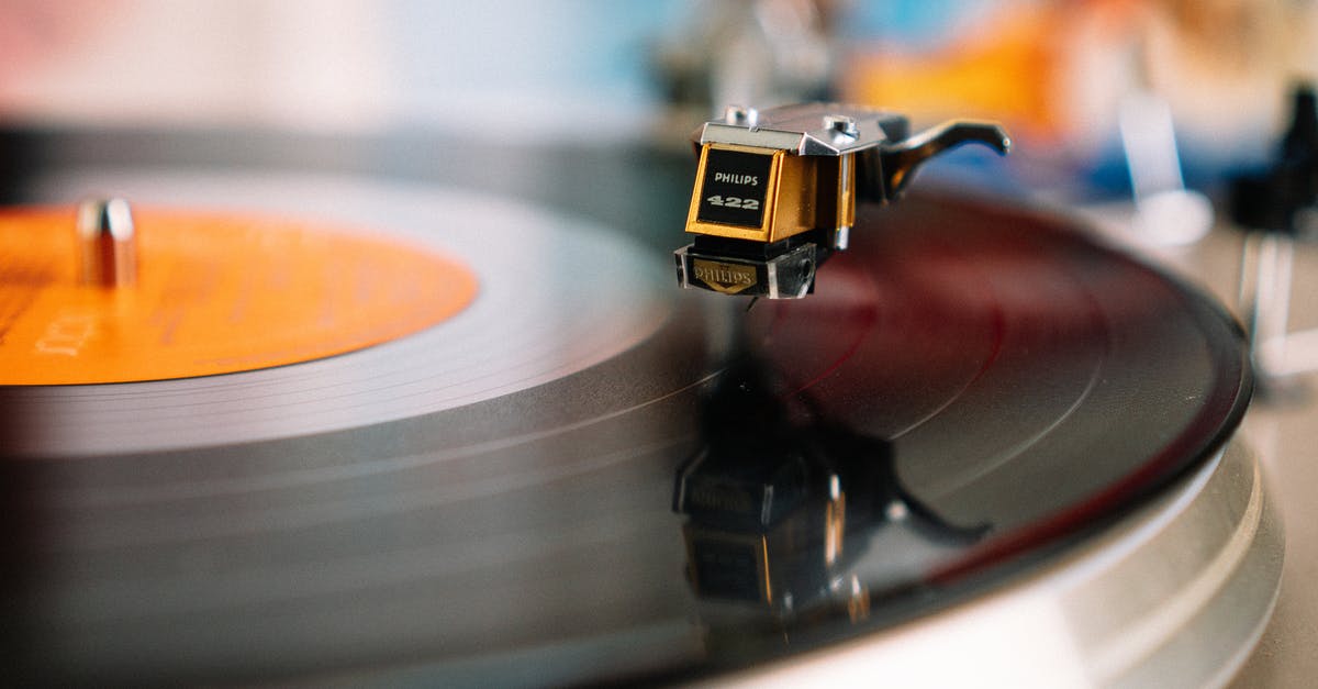 How can I mute music and sounds while playing? - Retro turntable playing vinyl disc in living room How can I mute music and sounds while playing? - Retro turntable playing vinyl disc in living room