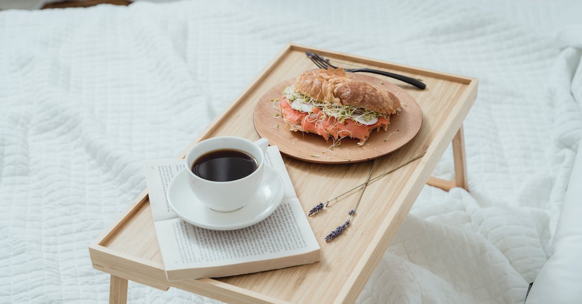 How can I place my bed on glass blocks? - Bread With Ham on White Ceramic Plate Beside White Ceramic Mug on Brown Wooden Tray