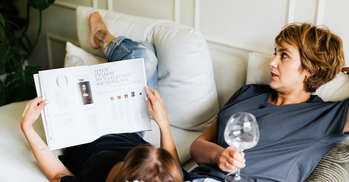 How can I place my bed on glass blocks? - Woman in Gray Shirt Sitting on White Couch How can I place my bed on glass blocks? - Woman in Gray Shirt Sitting on White Couch