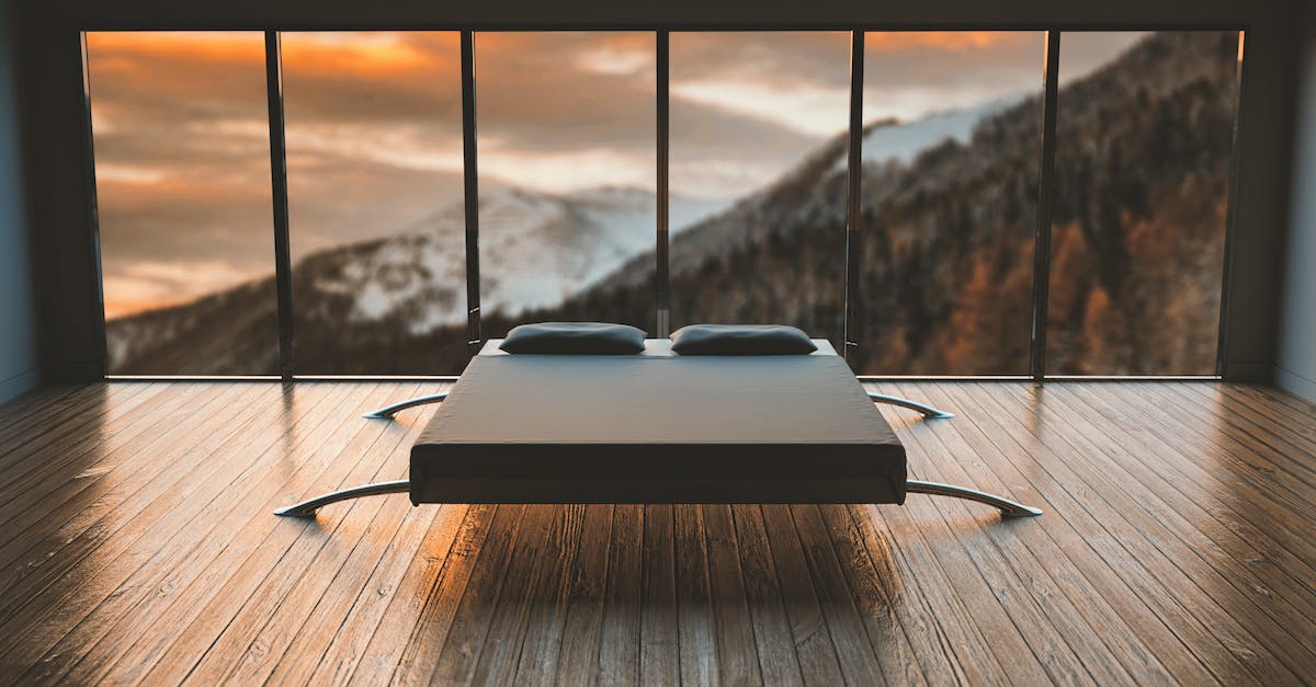 How can I place my bed on glass blocks? - Black Mattress in Front of a Large Window Behind a Mountain How can I place my bed on glass blocks? - Black Mattress in Front of a Large Window Behind a Mountain