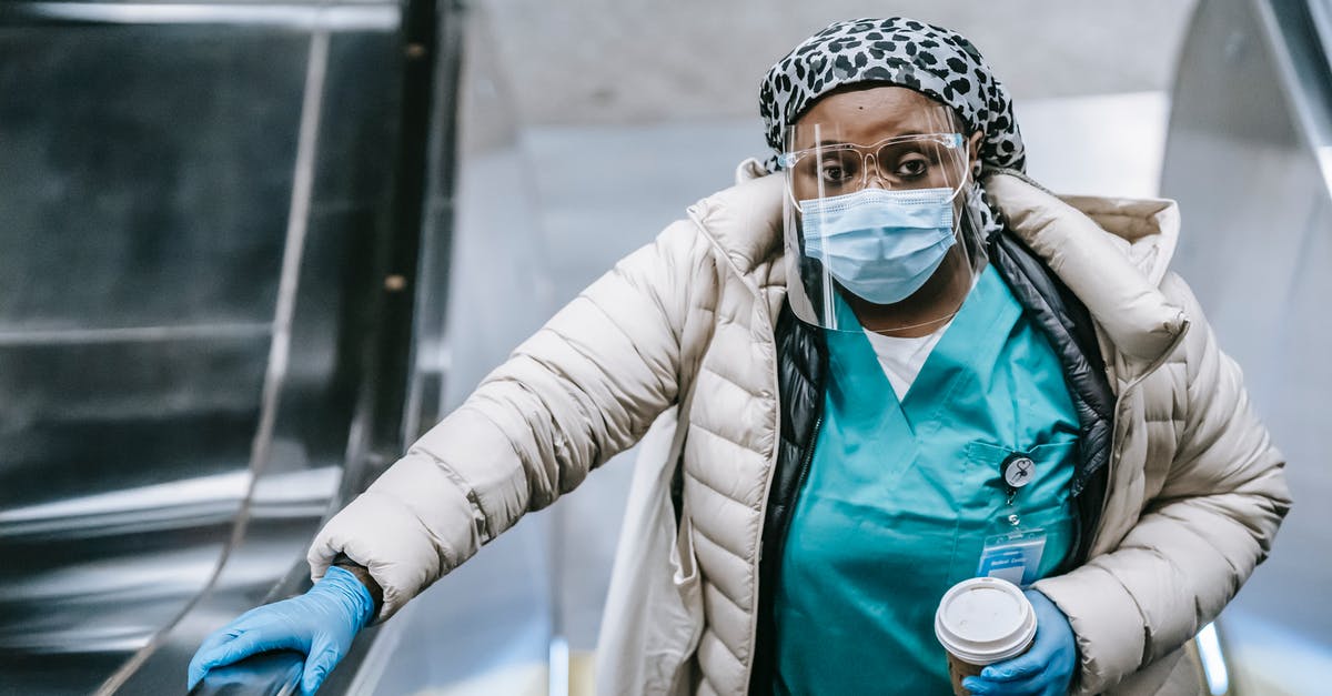 How can I prevent enemies from going through doors aboard my ship? - Calm black nurse riding escalator in metro