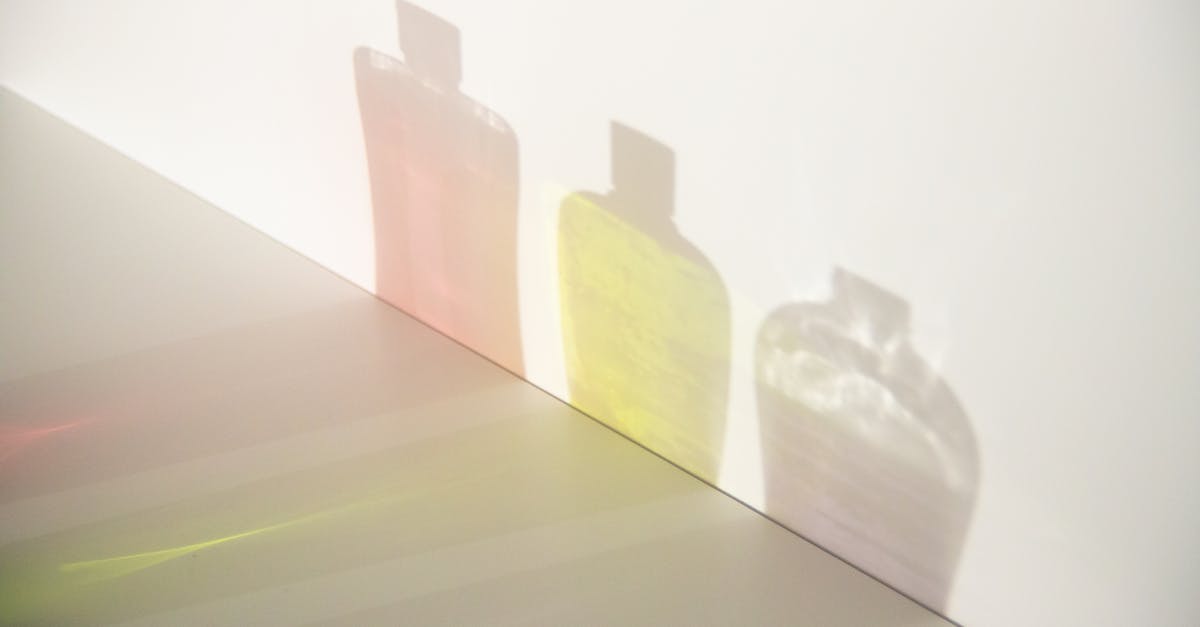 How can I prevent fireballs from setting fire? - From above of different bottle shadows with bright liquids and caps in row on smooth surface How can I prevent fireballs from setting fire? - From above of different bottle shadows with bright liquids and caps in row on smooth surface
