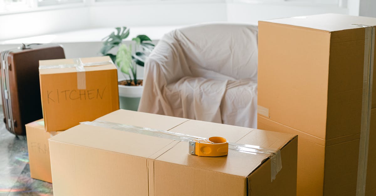 How can I receive a new verification email? - Empty apartment with packed carton boxes before moving