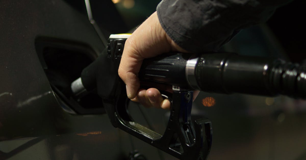 How can I refill a gas canister? - Person Holding Gasoline Nozzle How can I refill a gas canister? - Person Holding Gasoline Nozzle