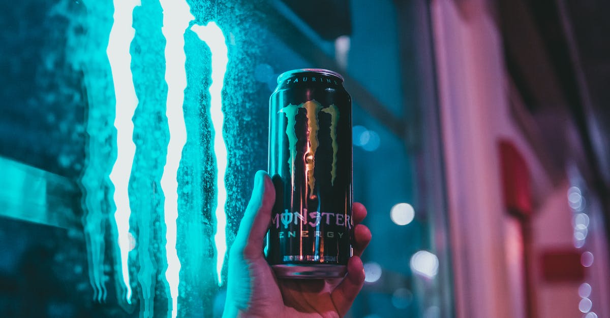 How can I refund purchases? - Person Holding Black Can in Front of Blue and White Wall