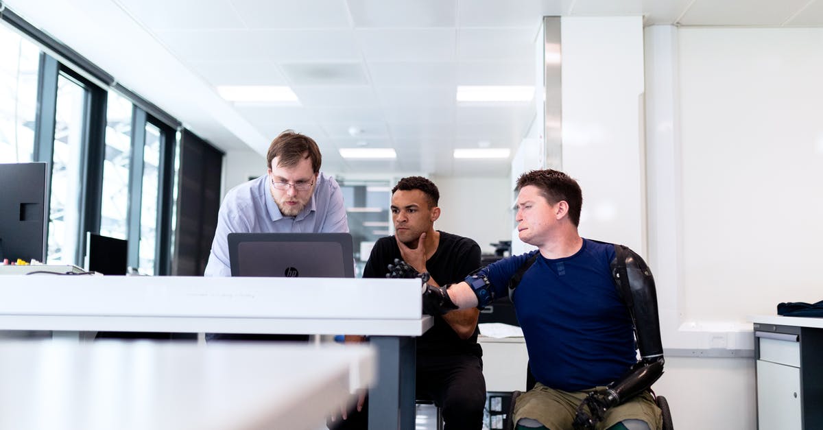 How can I safely upgrade to robot limbs in Kenshi? - Men Looking at Computer