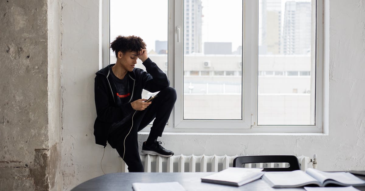 How can I scroll down to read the full item descriptions? - Tired African American male student surfing charging mobile phone during break in studies in loft style room How can I scroll down to read the full item descriptions? - Tired African American male student surfing charging mobile phone during break in studies in loft style room