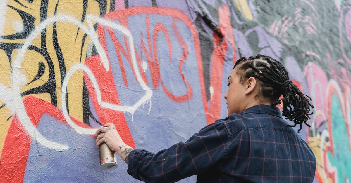 How can I seal the holes my essentia tubes created? - Ethnic woman painting graffiti on wall How can I seal the holes my essentia tubes created? - Ethnic woman painting graffiti on wall