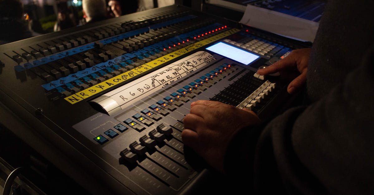 How can I show enemy health using console? - Crop anonymous male sound director adjusting faders on modern mixer board during live concert How can I show enemy health using console? - Crop anonymous male sound director adjusting faders on modern mixer board during live concert