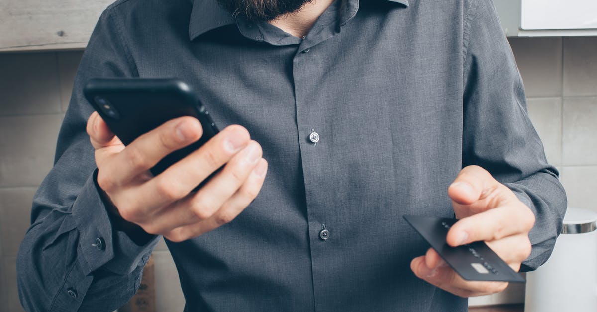How can I solve Steam Error -107/Secure Connection Failed? - Man in Blue Dress Shirt Holding Black Smartphone