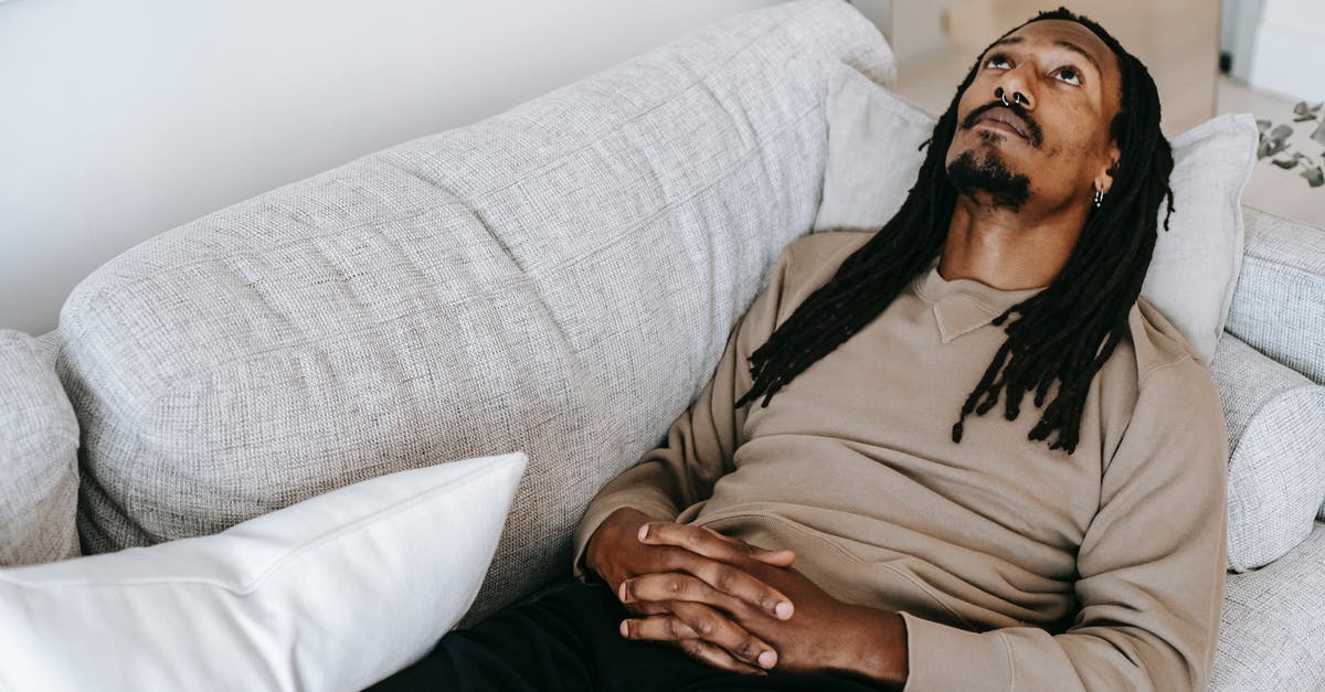 How can I speed up recovery from "shaken"? - Pensive black man lying on couch