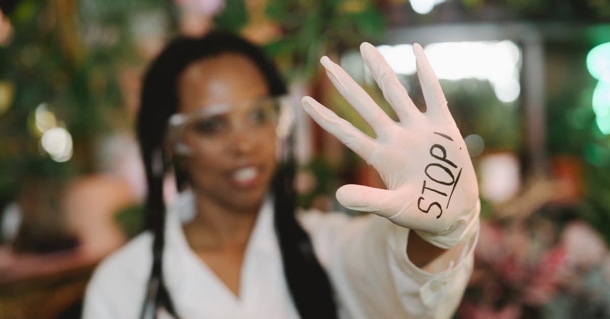 How can I stop guards congregating in yards? - Woman in White Long Sleeve Shirt Wearing Black Framed Eyeglasses