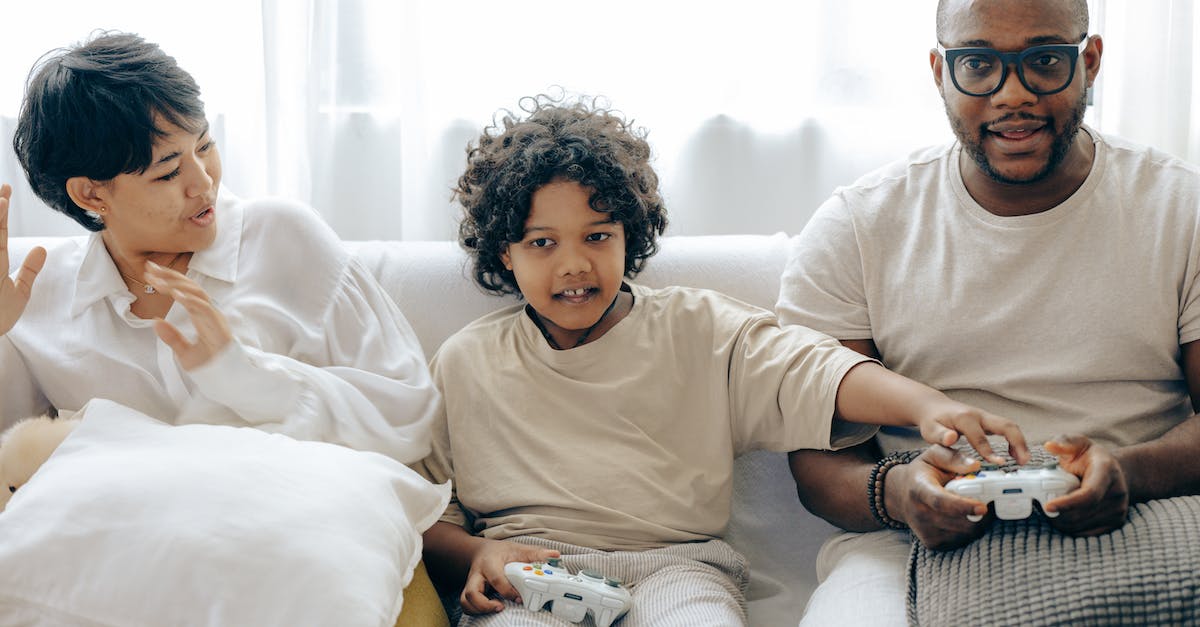 How can I stop without destroying the minecart nor using redstone? - Interested ethnic kid preventing father from winning in video game while resting together with mother in living room