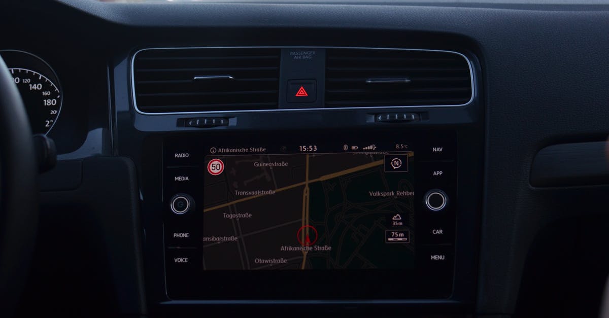 How can I track currently available maps - Interior of modern car with steering wheel and navigation system showing route through city streets How can I track currently available maps - Interior of modern car with steering wheel and navigation system showing route through city streets