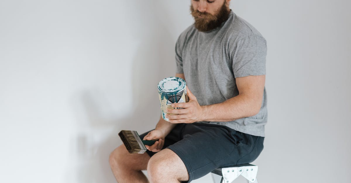 How can I unlock new components? - Crop hipster man with can on paint on ladder