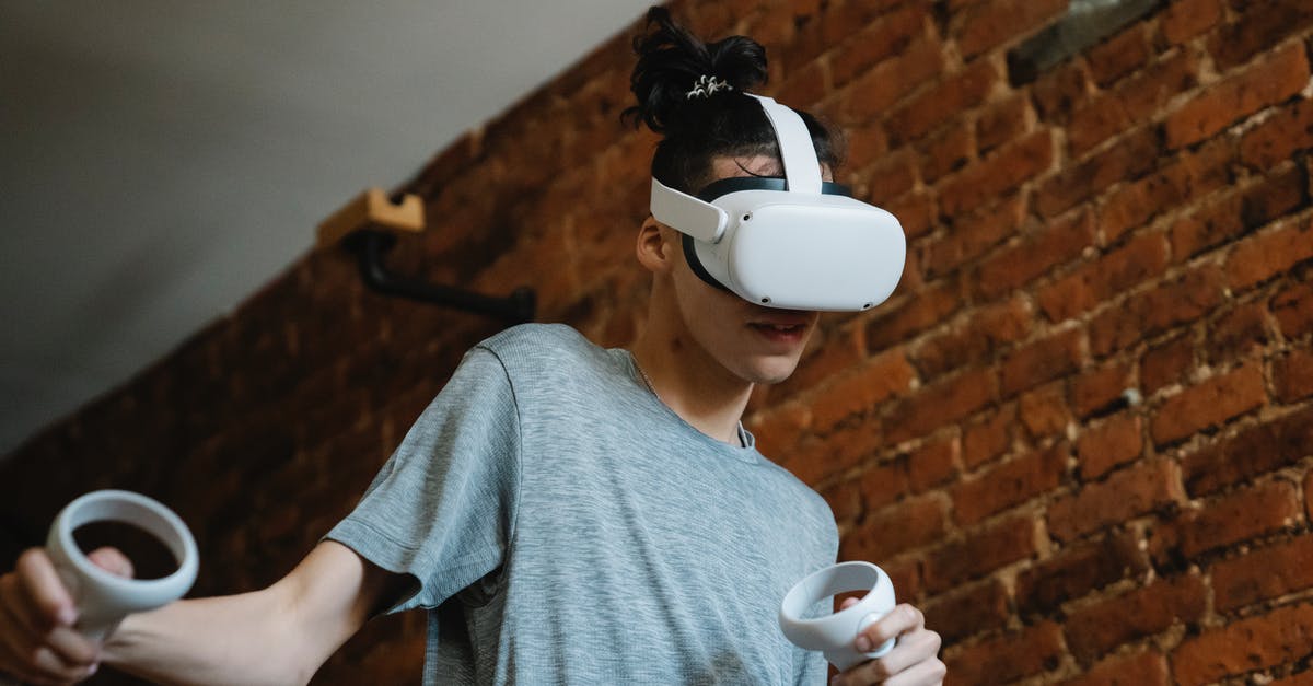 How can I use a headset for in game chat when streaming a game from my XBox One to my Windows 10 PC? - Male teen using VR device