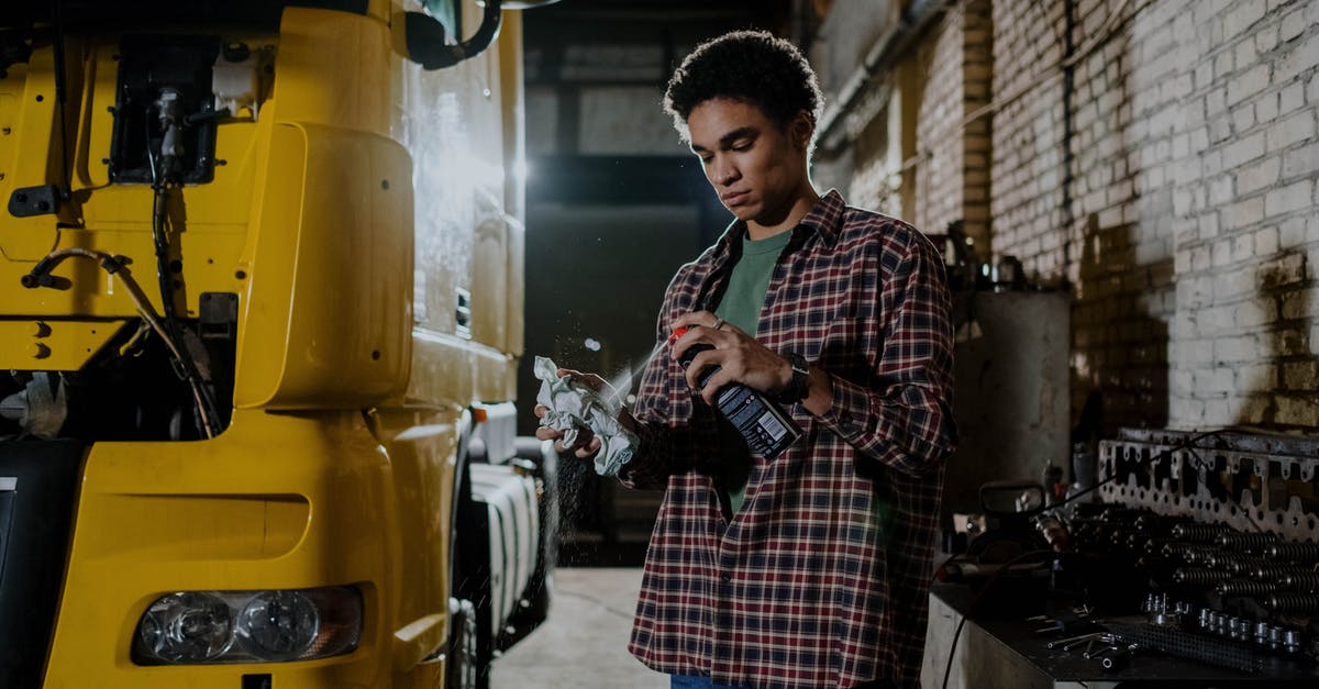 How can I use non Steam workshop mods in Euro Truck Simulator 2? [duplicate] - Man Wearing Plaid Long Sleeves Polo Holding a Spray Can
