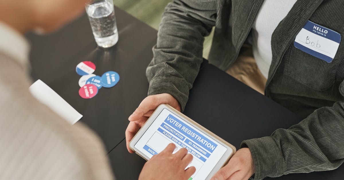 How can I view equipped artifact details in the Heroes III iPad app? - People using a Tablet while Doing Voter's Registration