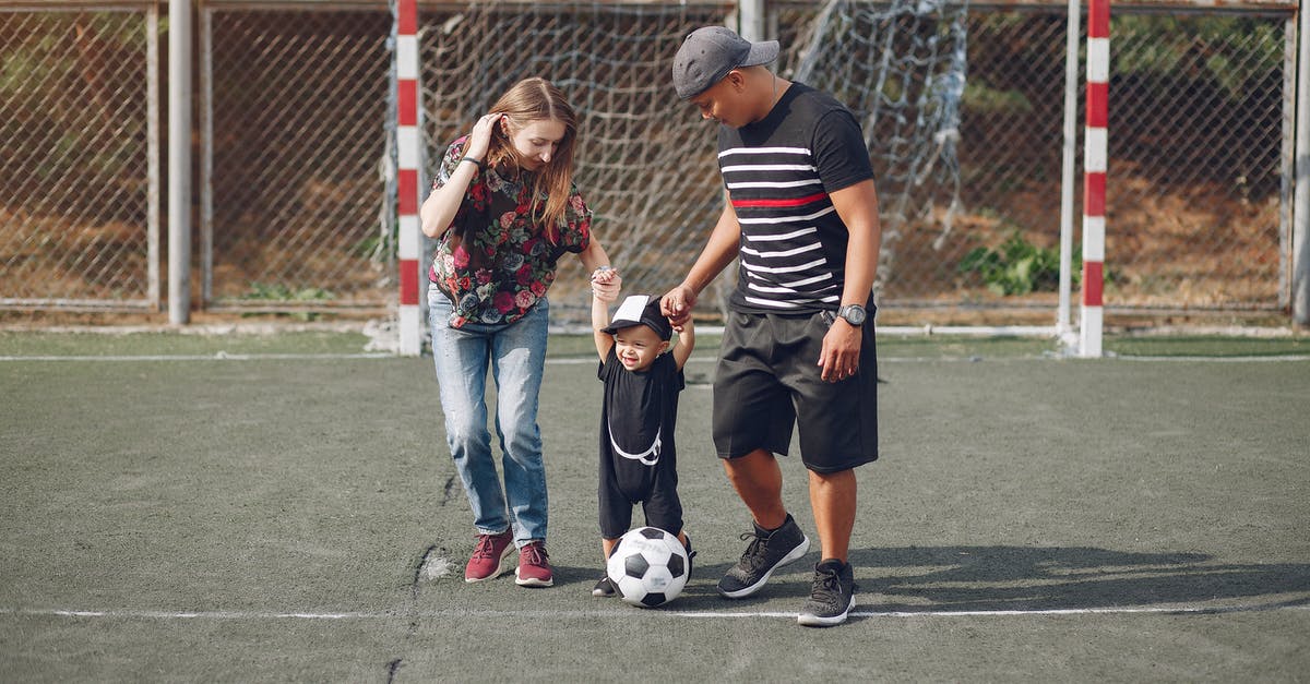 How can I walk automatically in games that don't support it? - Content family with toddler boy on football field